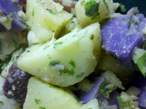 In this potato salad, I used white and blue potatoes along with chopped fresh herbs.